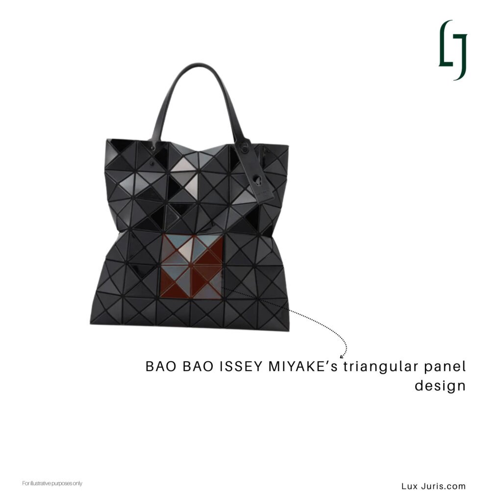 Image: A geometric BAO BAO ISSEY MIYAKE bag with glossy triangular panels that shift with movement.